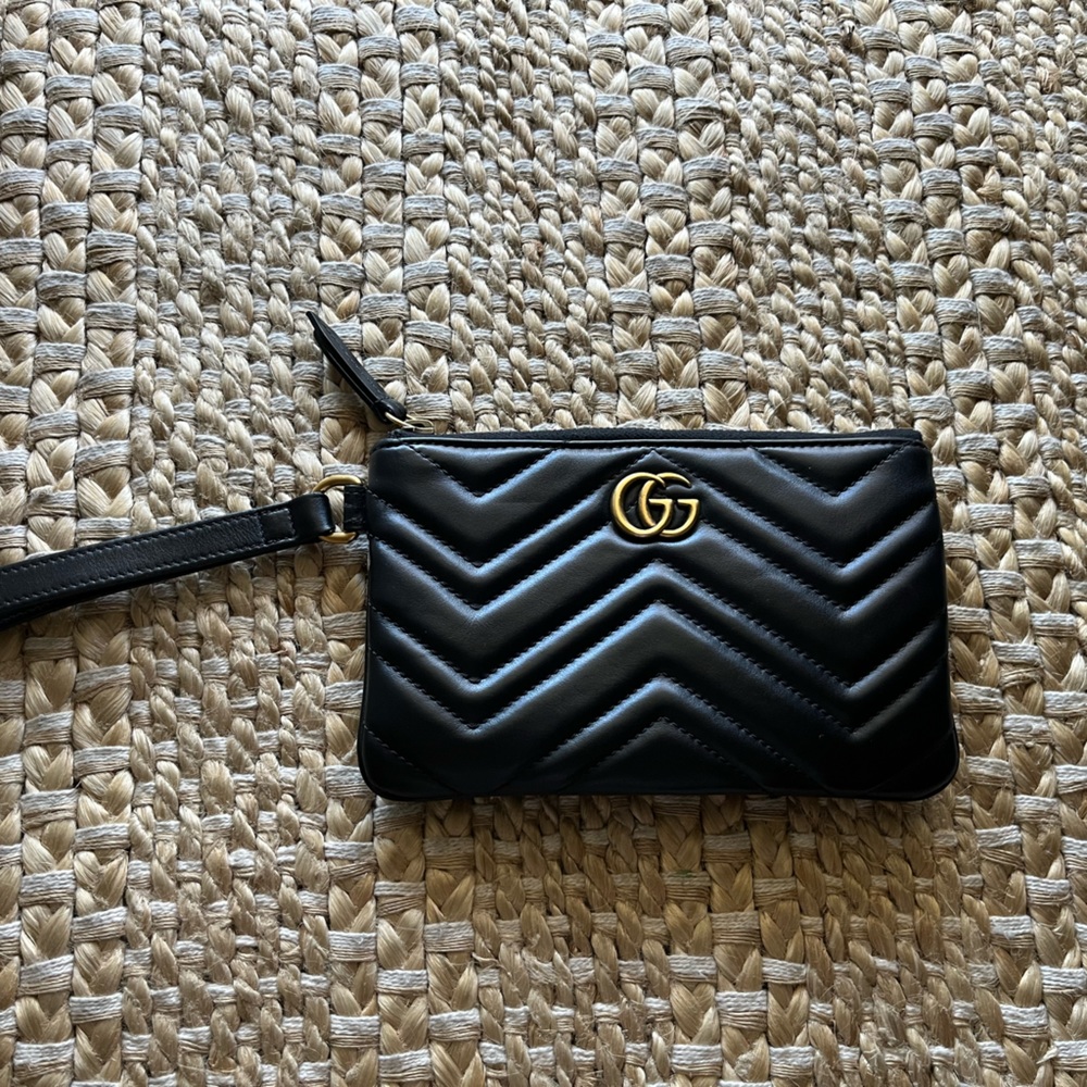 Black authentic Gucci quilted leather wristlet.